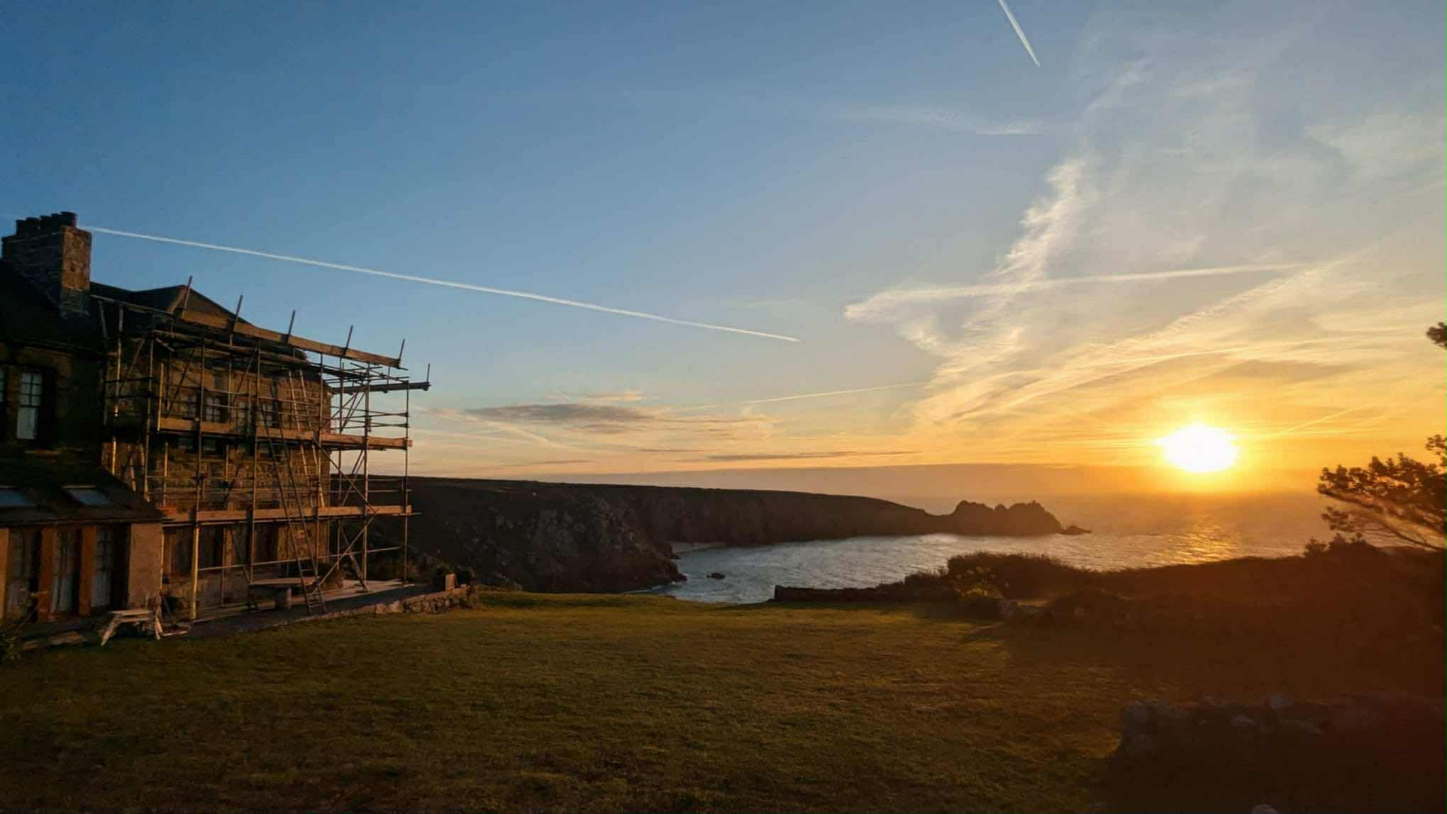 Heritage scaffolding on a coastal cliffside cottage in Cornwall