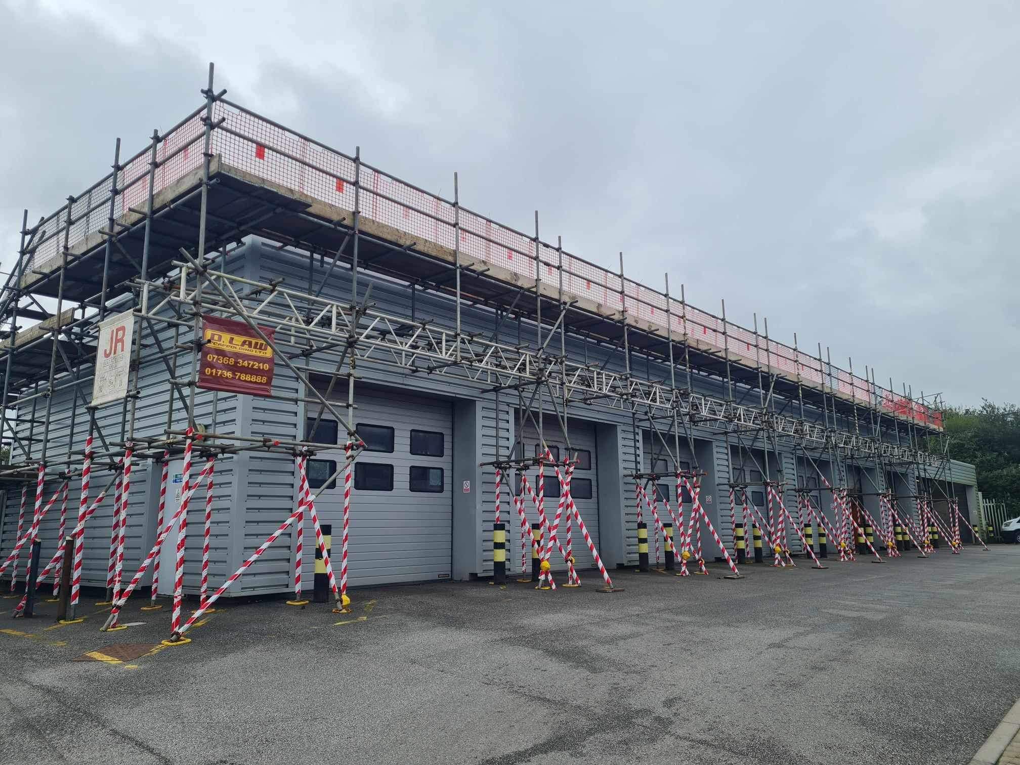 Internal birdcage scaffolding inside an industrial factory